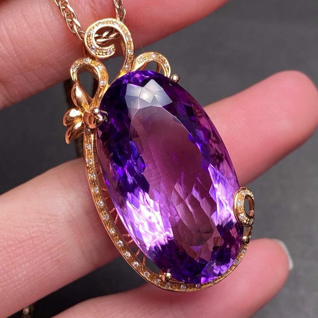14k Gold 33.3 Ct Natural Amethyst & Diamond Pendant( Without Chain ): Ref:231083056 // gold content:14k gold // main gemstone:amethyst // shape:oval // carat weight:33. 3ct // color:purple // treatment:natural // // adjacent gemstone 2 : diamond // number of stones:44 /
