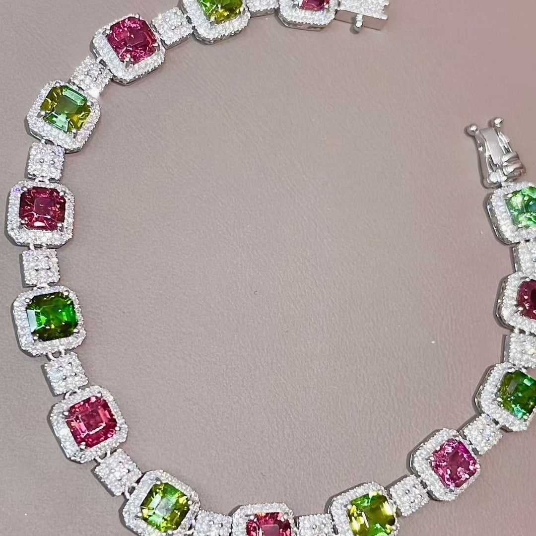 14k Gold 9.45 Ctw Natural Tourmaline & Diamond Bracelet: Ref:231083115 // gold content:14k gold // main gemstone:tourmaline // shape:octagonal // carat weight:7. 65ct // color:color // treatment:natural // // adjacent gemstone 2 : diamond // shape:round //