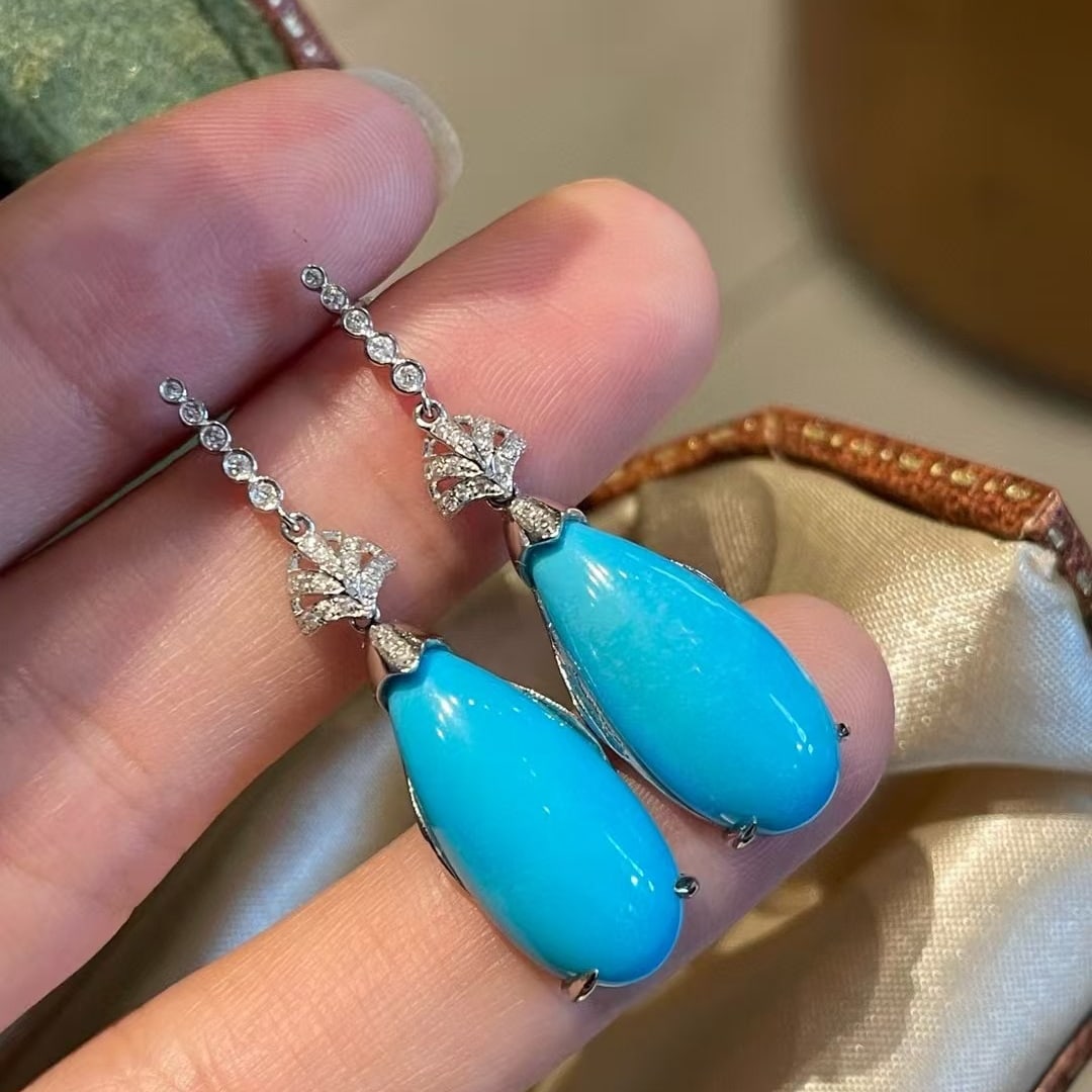 14k Gold 12.63 Ct Natural Blue Turquoise & Diamond Earrings: Ref:231083203 // gold content:14k gold // main gemstone:blue turquoise // shape:pear // carat weight:12. 63ct // color:blue // treatment:natural // // adjacent gemstone 2 : diamond // shape:round //