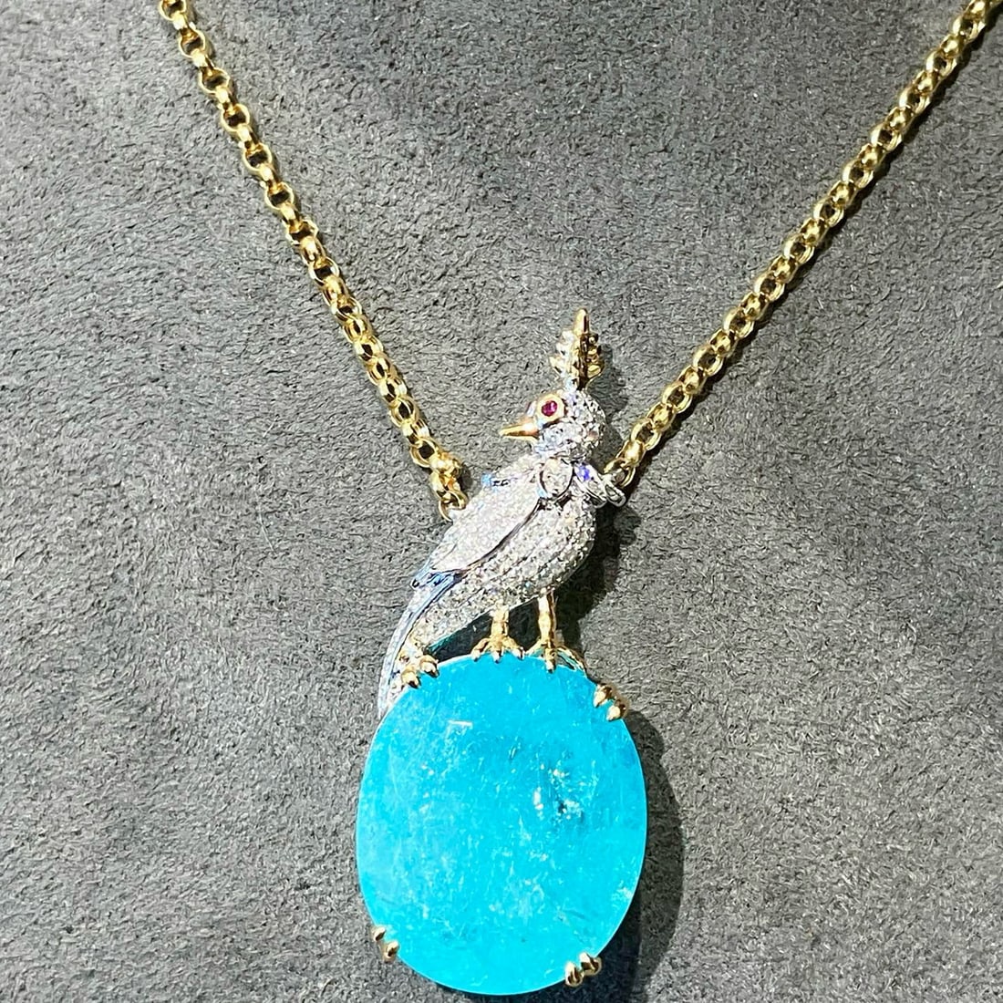 14k Gold 7.65 Ctw Natural Paraiba Tourmaline & Diamond Necklace: Ref:231083209 // gold content:14k gold // main gemstone:paraiba tourmaline // shape:oval // carat weight:7. 42ct // color:blue // treatment:natural // // adjacent gemstone 2 : diamond // shape:round