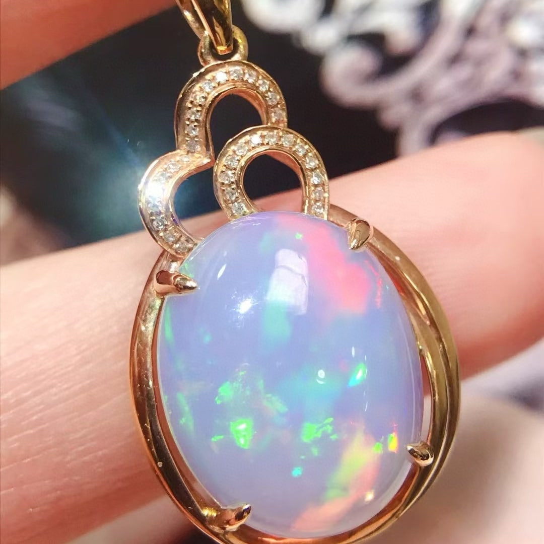 14k Gold 6 Ct Natural Opal & Diamond Pendant( Without Chain ): Ref:231083228 // gold content:14k gold // main gemstone:opal // shape:oval // carat weight:6ct // color:color // treatment:natural // // adjacent gemstone 2 : diamond // number of stones:32 //
