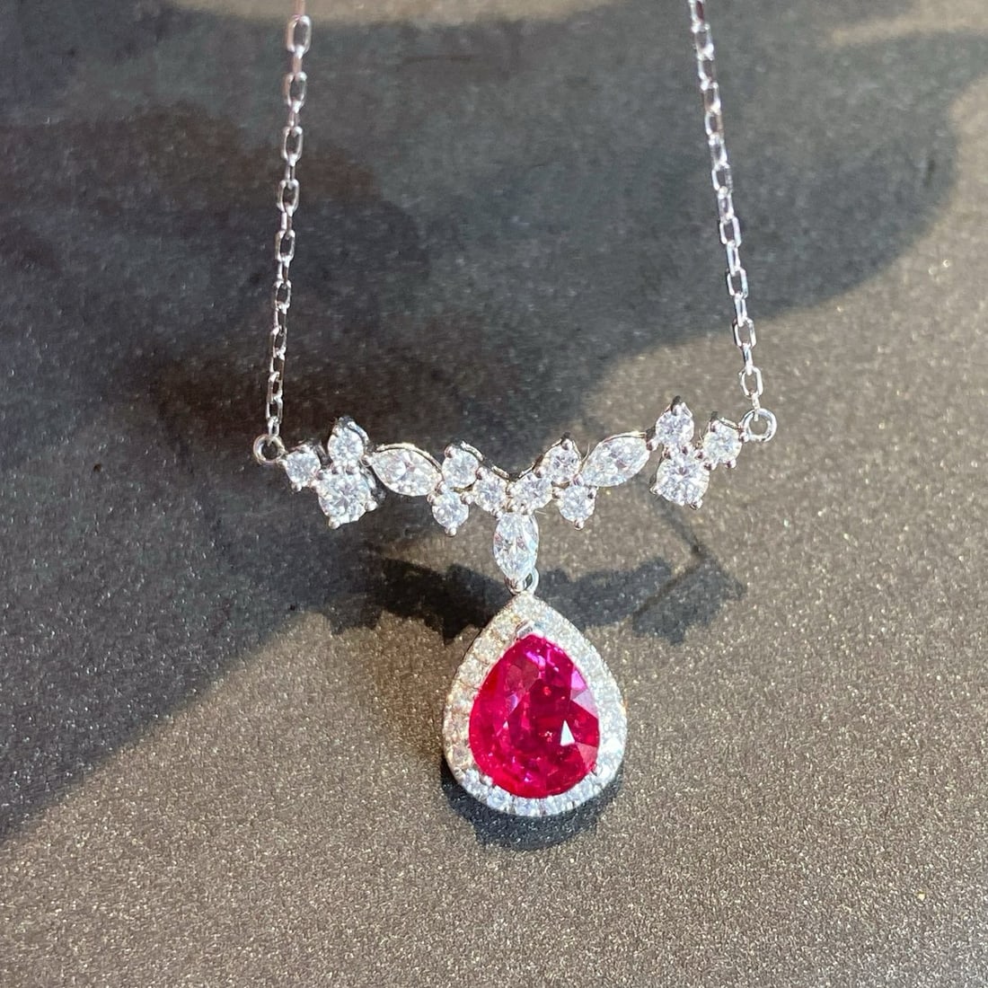 14k Gold 1.21 Ctw Natural Ruby & Diamond Necklace: Ref:231084123 // gold content:14k gold // main gemstone:ruby // shape:pear // carat weight:0. 83ct // color:red // treatment:natural // // adjacent gemstone 2 : diamond // shape:multiple // carat