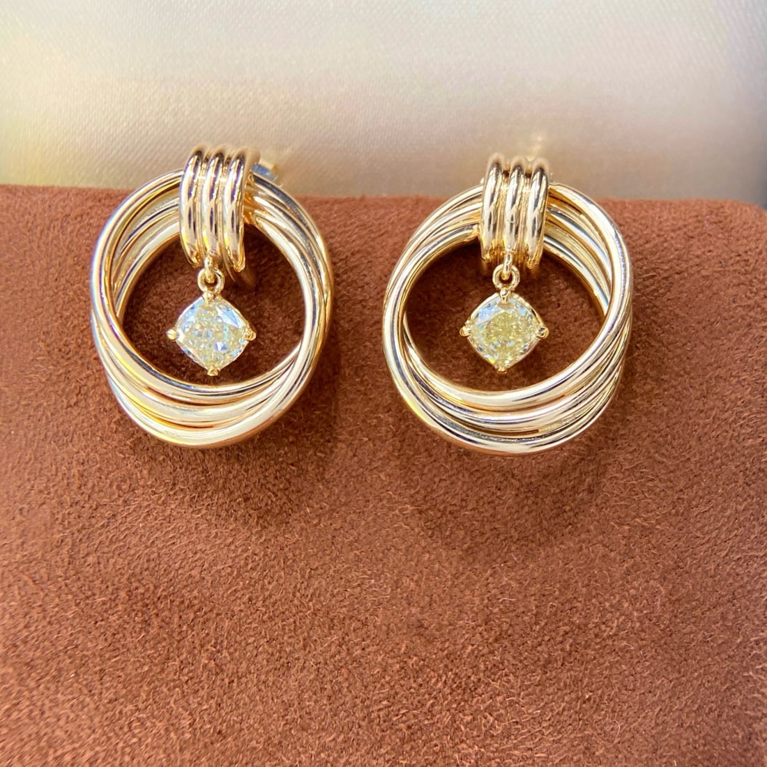 14k Gold 1.10 Ct Natural Yellow Diamond Earrings: Ref:231084160 // gold content:14k gold // main gemstone:yellow diamond // shape:cushion // carat weight:1. 10ct // color:yellow // treatment:natural // Condition: New Low Estimate: 8800.00 High