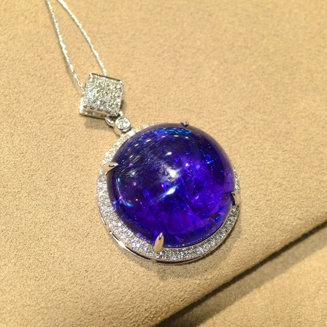 14k Gold 16.61 Ctw Natural Tanzanite & Diamond Pendant( Without Chain ): Ref:231084219 // gold content:14k gold // main gemstone:tanzanite // shape:round // carat weight:16. 25ct // color:blue // treatment:natural // cut grade:g // // adjacent gemstone 2 : diamond //