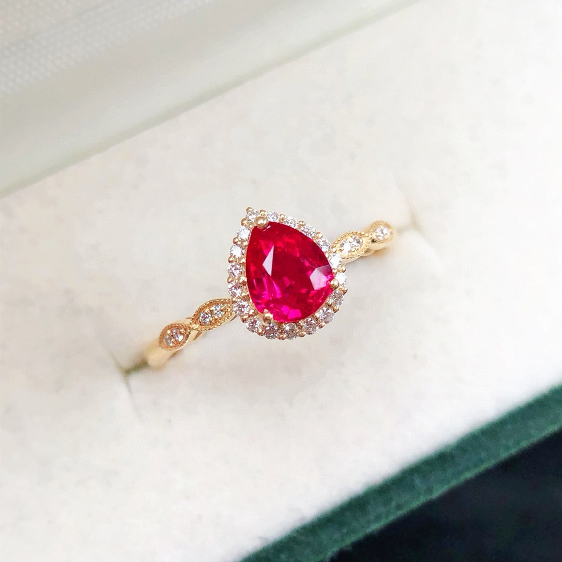 14k Gold 0.81 Ctw Vivid Red Natural Ruby & Diamond Ring: Ref:231084438 // gold content:14k gold // ring size:7. 25us // // main gemstone:ruby // shape:pear // carat weight:0. 70ct // color:vivid red // treatment:natural // // adjacent gemstone 2 : diamond