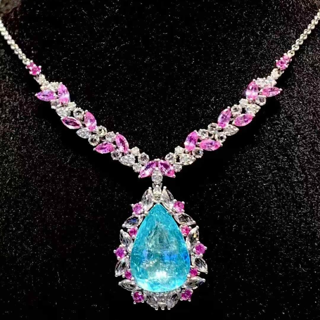 14k Gold 6.19 Ct Natural Paraiba Tourmaline & Diamond & Sapphire Necklace: Ref:231089011 // gold content:14k gold // main gemstone:paraiba tourmaline // shape:pear // carat weight:6. 19ct // color:blue // treatment:natural // // adjacent gemstone 2 : diamond // shape:round /