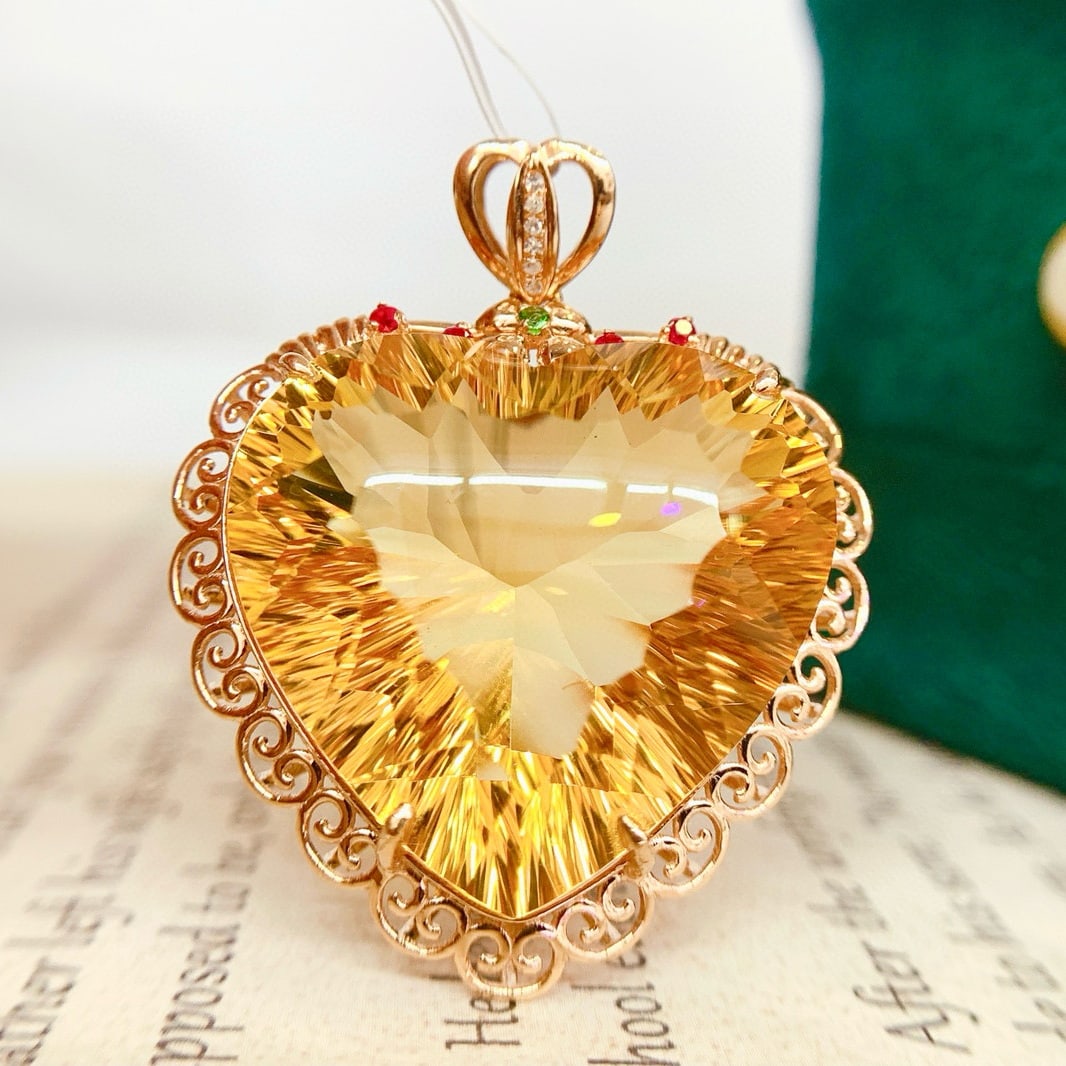 14k Gold 32.9 Ct Natural Citrine & Diamond Pendant( Without Chain ): Ref:231089019 // gold content:14k gold // main gemstone:citrine // shape:heart // carat weight:32. 9ct // color:yellow // treatment:natural // // adjacent gemstone 2 : diamond // shape:round //