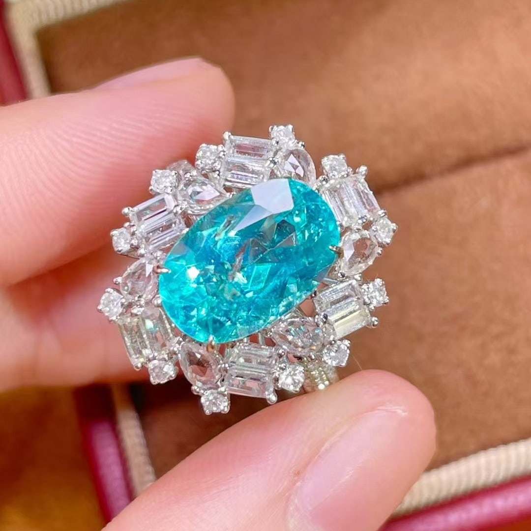 14k Gold 4.50 Ctw Natural Paraiba Tourmaline & Sapphire Ring: Ref:231089045 // gold content:14k gold // ring size:7. 25us // // main gemstone:paraiba tourmaline // shape:oval // carat weight:3. 44ct // color:blue // treatment:natural // // adjacent gemstone 2 :