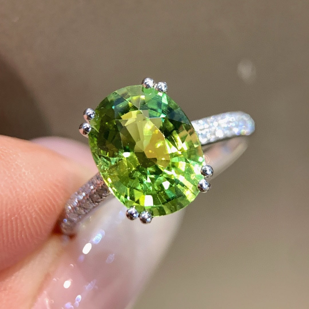 14k Gold 3.39 Ctw Natural Tourmaline & Diamond Ring: Ref:231089046 // gold content:14k gold // ring size:7. 25us // // main gemstone:tourmaline // shape:oval // carat weight:3. 29ct // color:green // treatment:natural // // adjacent gemstone 2 :