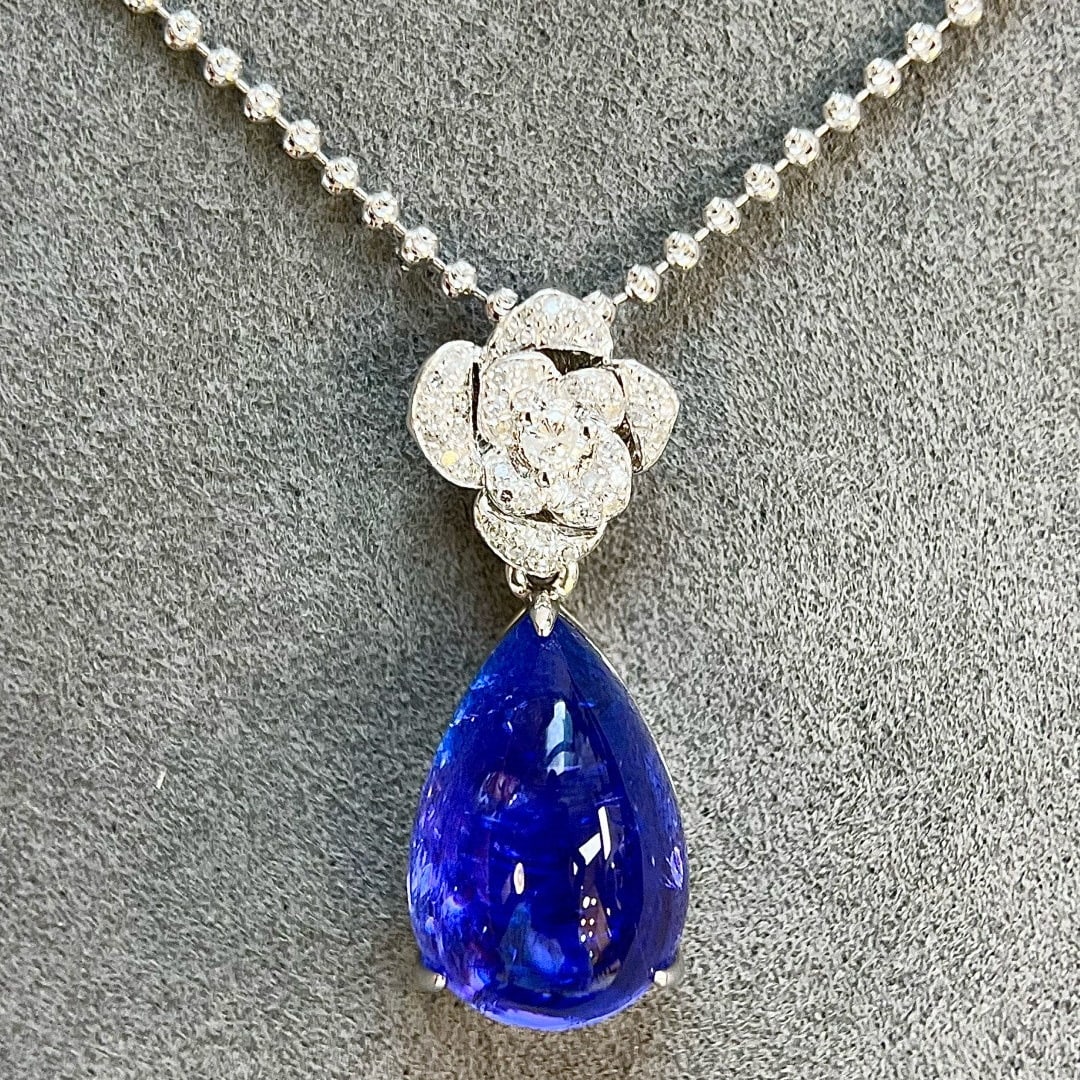 14k Gold 11.61 Ctw Natural Tanzanite & Diamond Pendant( Without Chain ): Ref:231089088 // gold content:14k gold // main gemstone:tanzanite // shape:pear // carat weight:11. 45ct // color:blue // treatment:natural // // adjacent gemstone 2 : diamond // shape:round // carat