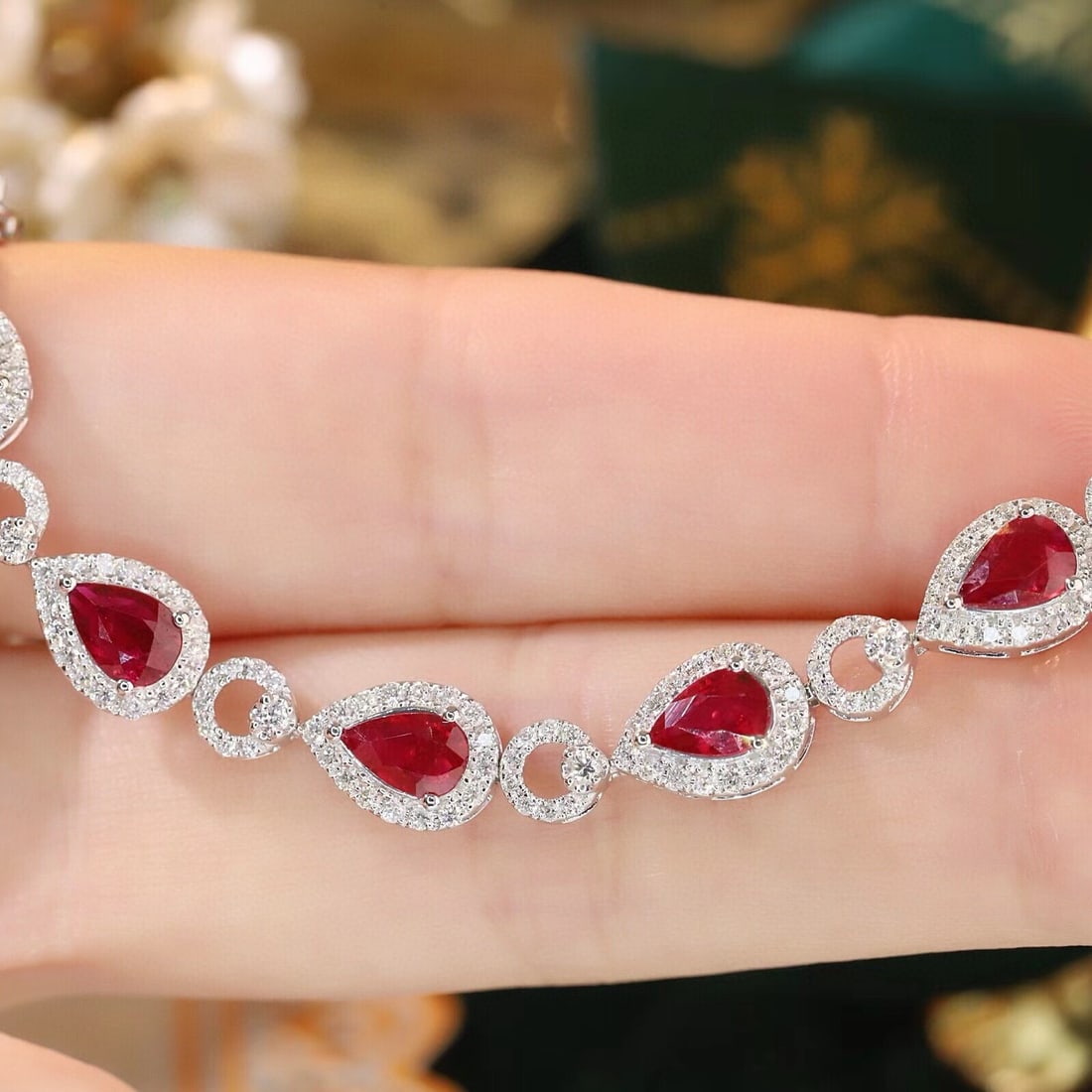 14k Gold 6.7 Ctw Natural Ruby & Diamond Bracelet: Ref:231089174 // gold content:14k gold // main gemstone:ruby // shape:pear // carat weight:5ct // color:red // treatment:natural // // adjacent gemstone 2 : diamond // shape:round // carat weight:1. 7