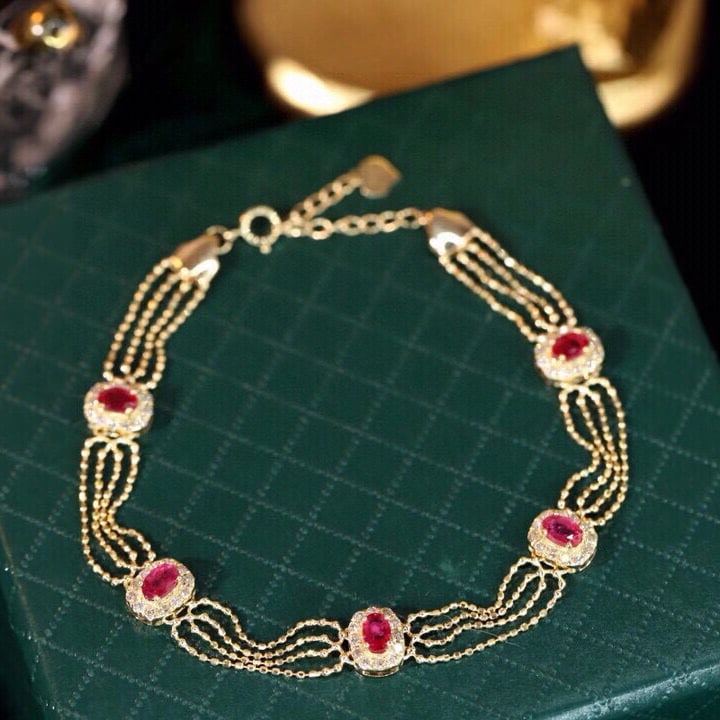 14k Gold 2.15 Ctw Natural Ruby & Diamond Bracelet: Ref:231089219 // gold content:14k gold // main gemstone:ruby // shape:oval // carat weight:1. 5ct // color:red // treatment:natural // // adjacent gemstone 2 : diamond // shape:round // carat weight:0