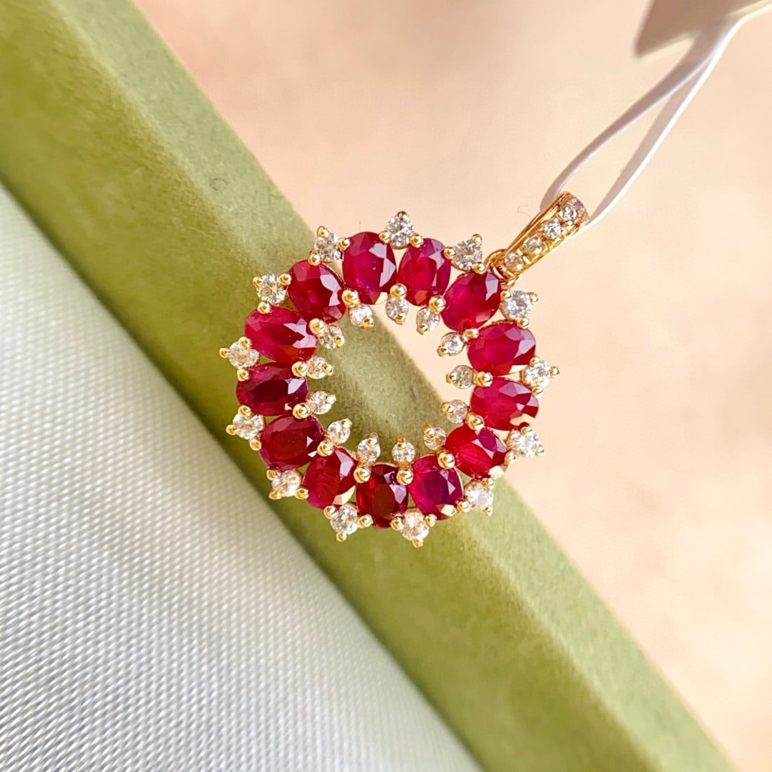 14k Gold 1.60 Ct Natural Ruby & Sapphire Pendant( Without Chain ): Ref:231090205 // gold content:14k gold // main gemstone:ruby // shape:oval // carat weight:1. 60ct // color:red // treatment:natural // // adjacent gemstone 2 : sapphire // number of stones:31 //