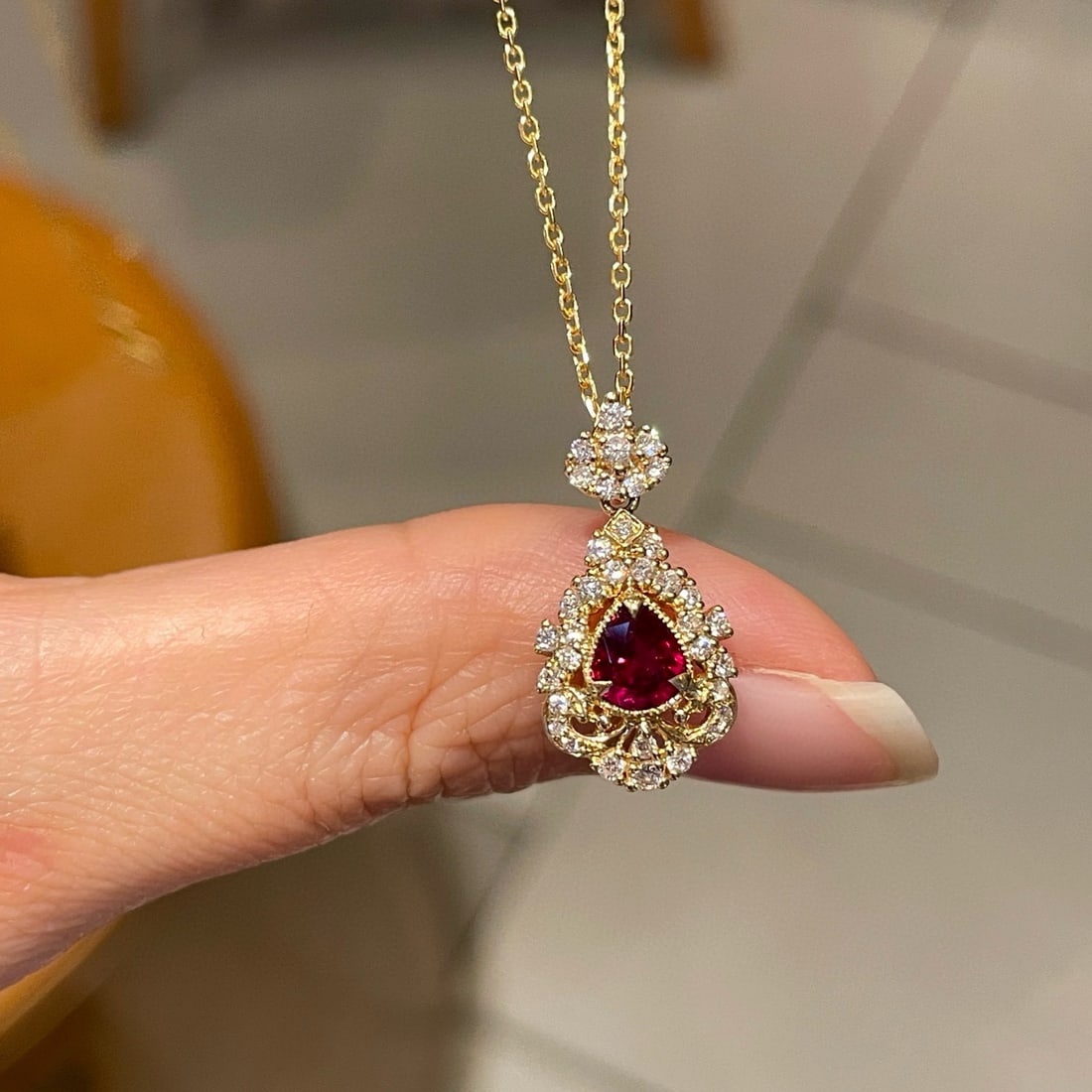 14k Gold 0.45 Ct Natural Ruby & Diamond Pendant( Without Chain ): Ref:231090229 // gold content:14k gold // main gemstone:ruby // shape:pear // carat weight:0. 45ct // color:red // treatment:natural // // adjacent gemstone 2 : diamond // shape:round // clarity