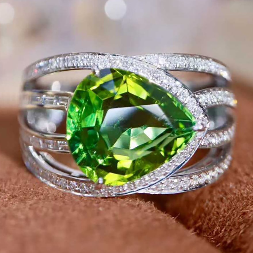 14k Gold 4.58 Ctw Natural Tourmaline & Diamond Ring: Ref:231090293 // gold content:14k gold // ring size:7. 25us // // main gemstone:tourmaline // shape:pear // carat weight:4. 15ct // color:green // treatment:natural // // adjacent gemstone 2 :
