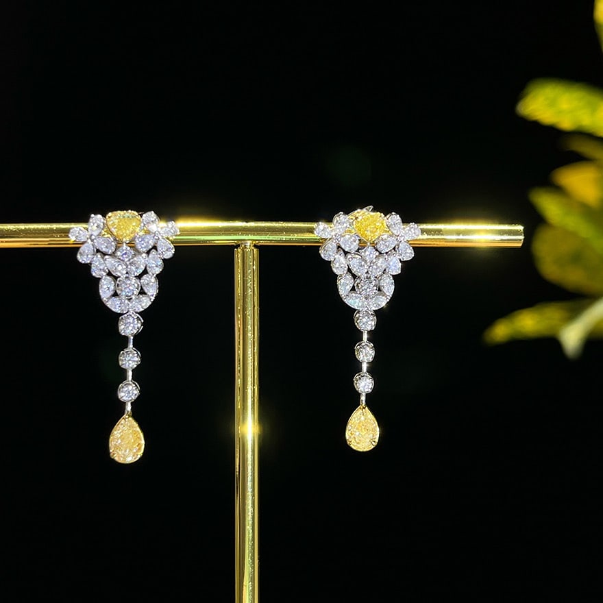 14k Gold 2.10 Ct Natural Color Diamond Earrings: Ref:231090319 // gold content:14k gold // main gemstone:diamond // shape:multiple // carat weight:2. 10ct // clarity grade:vs-si // color:color // treatment:natural // Condition: New Low Estimate: 900
