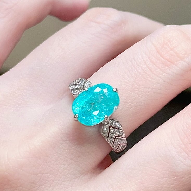14k Gold 3.91 Ctw Natural Paraiba Tourmaline & Diamond Ring: Ref:231081134 // gold content:14k gold // ring size:7. 25us // // main gemstone:paraiba tourmaline // shape:oval // carat weight:3. 75ct // color:blue // treatment:natural // // adjacent gemstone 2 :