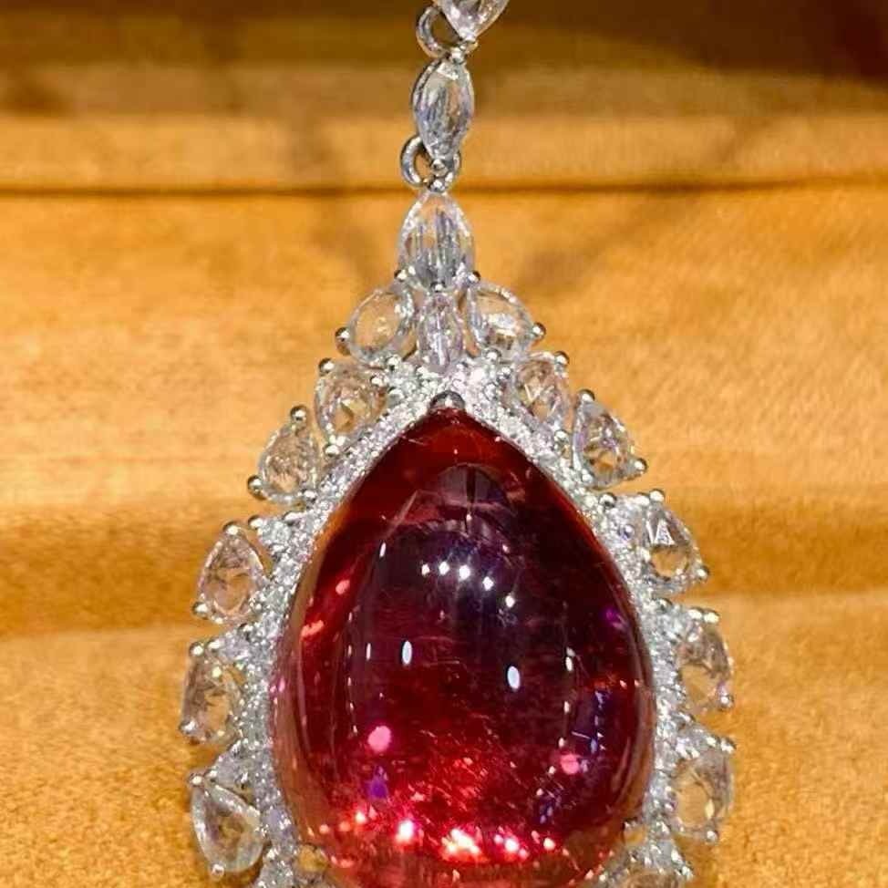 14k Gold 10.7 Ct Natural Tourmaline & Diamond & Sapphire Pendant( Without Chain ): Ref:231081214 // gold content:14k gold // main gemstone:tourmaline // shape:pear // carat weight:10. 7ct // color:red // treatment:natural // // adjacent gemstone 2 : diamond // shape:round //