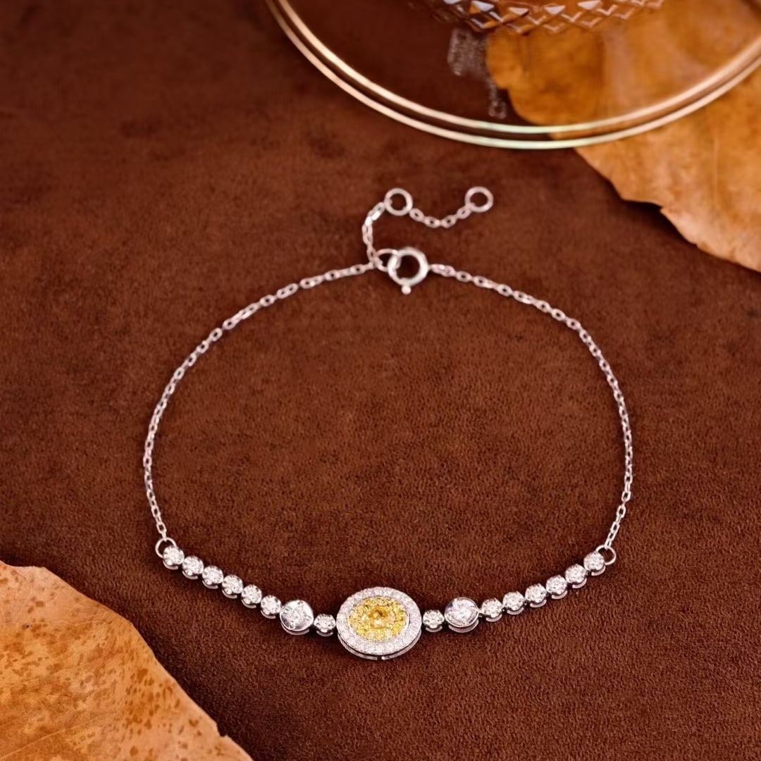 14k Gold 0.60 Ctw Natural Yellow Diamond & Diamond Bracelet: Ref:231081248 // gold content:14k gold // main gemstone:yellow diamond // shape:oval // carat weight:0. 18ct // color:yellow // treatment:natural // // adjacent gemstone 2 : diamond // shape:round //