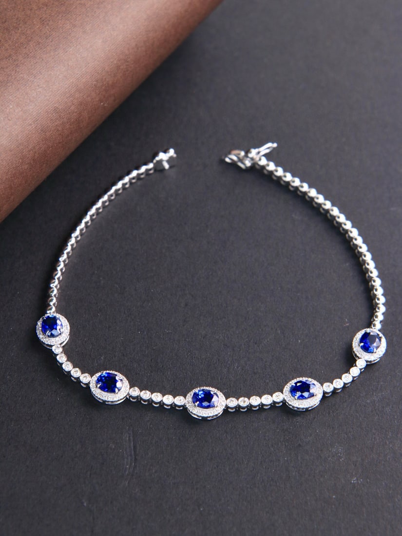 14k Gold 2.29 Ctw Vivid Blue Natural Sapphire & Diamond Bracelet: Ref:231082310 // gold content:14k gold // main gemstone:sapphire // shape:oval // carat weight:1. 89ct // color:vivid blue // treatment:natural // // adjacent gemstone 2 : diamond // shape:round //