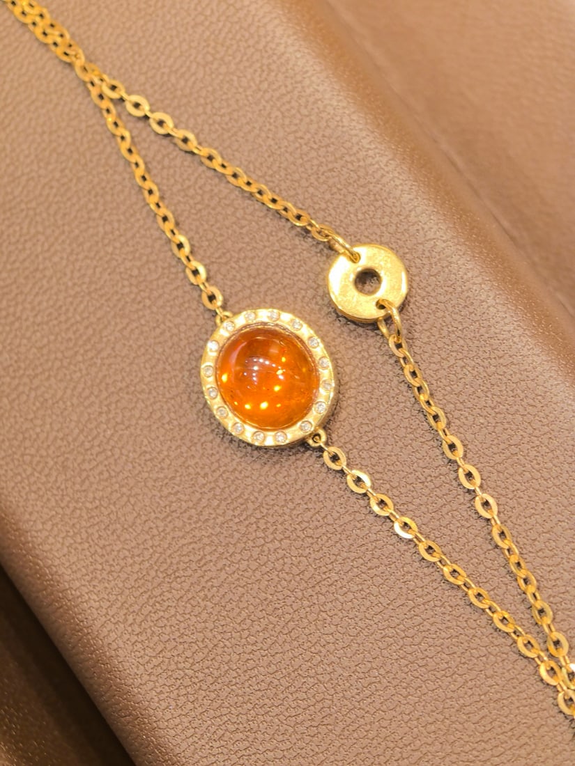 14k Gold 3.54 Ctw Natural Spessartine & Diamond Bracelet: Ref:231082311 // gold content:14k gold // main gemstone:spessartine // shape:oval // carat weight:3. 48ct // color:orange // treatment:natural // // adjacent gemstone 2 : diamond // shape:round //