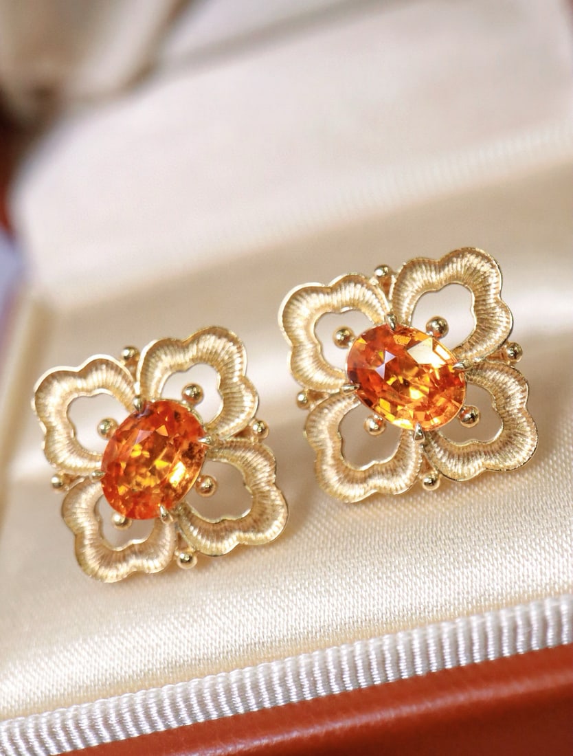 14k Gold 2.68 Ct Natural Spessartine Earrings: Ref:231082422 // gold content:14k gold // main gemstone:spessartine // shape:oval // carat weight:2. 68ct // color:orange // treatment:natural // Condition: New Low Estimate: 7000.00 High Estimate: