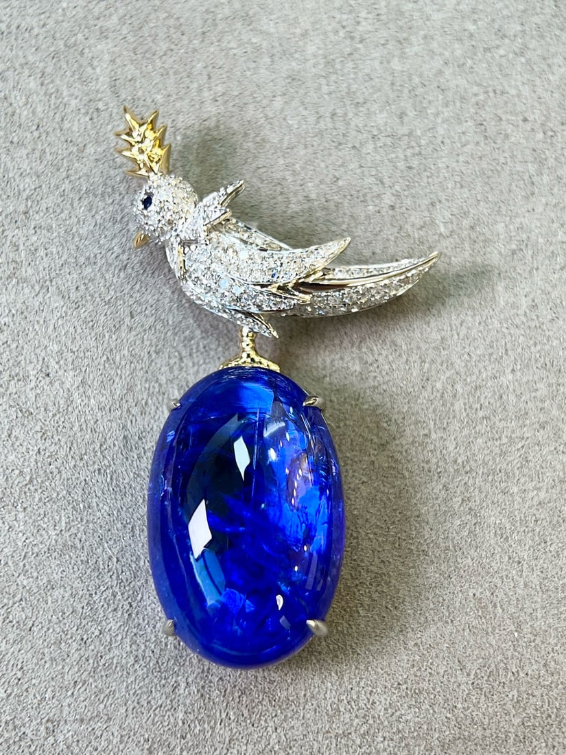 14k Gold 17.89 Ctw Natural Tanzanite & Diamond Brooch/pendant( Without Chain ): Ref:231082429 // gold content:14k gold // main gemstone:tanzanite // shape:oval // carat weight:17. 45ct // color:blue // treatment:natural // // adjacent gemstone 2 : diamond // shape:round // carat