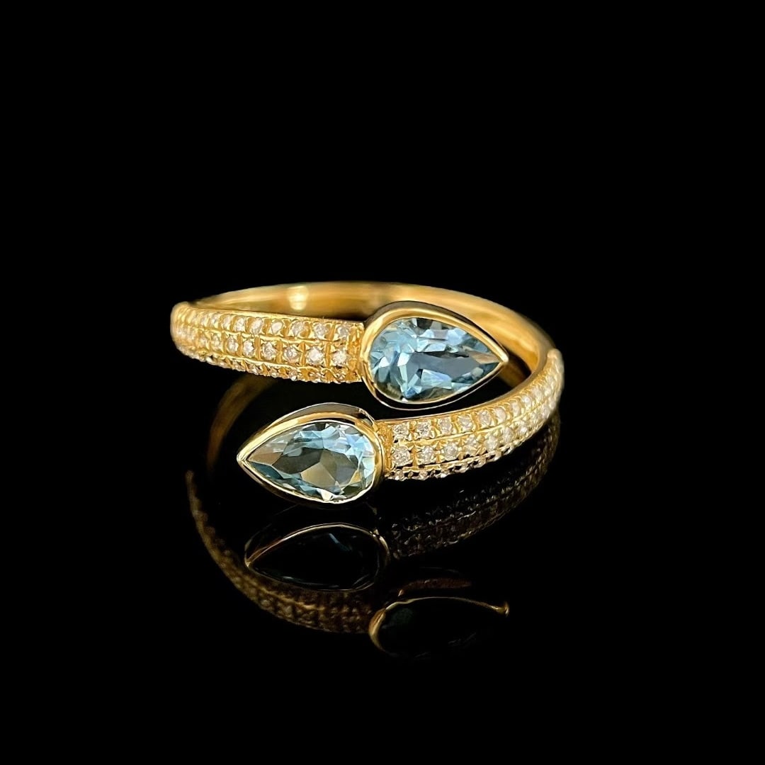 14k Gold 1.04 Ctw Natural Aquamarine & Diamond Ring: Ref:231081050 // gold content:14k gold // ring size:7. 25us // // main gemstone:aquamarine // shape:pear // carat weight:0. 8ct // color:blue // treatment:natural // // adjacent gemstone 2 : diamond