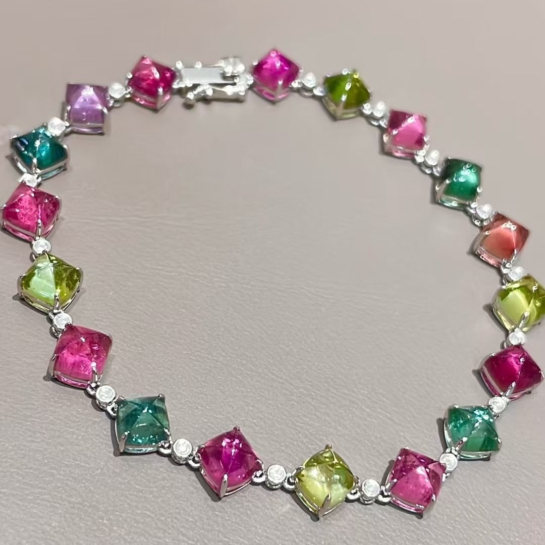14k Gold 13.2 Ct Natural Tourmaline & Diamond Bracelet: Ref:231081054 // gold content:14k gold // main gemstone:tourmaline // shape:sugar-loaf // carat weight:13. 2ct // color:color // treatment:natural // // adjacent gemstone 2 : diamond // shape:round