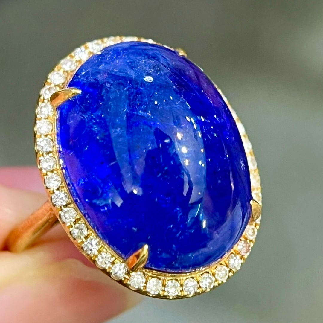14k Gold 21.62 Ctw Natural Tanzanite & Diamond Ring: Ref:231081217 // gold content:14k gold // ring size:7. 25us // // main gemstone:tanzanite // shape:oval // carat weight:21. 3ct // color:blue // treatment:natural // // adjacent gemstone 2 : diamond /
