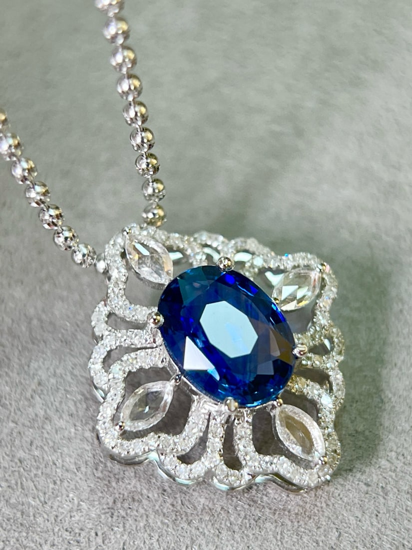14k Gold 2.63 Ctw Vivid Blue Natural Sapphire & Diamond Pendant( Without Chain ): Ref:231082194 // gold content:14k gold // main gemstone:sapphire // shape:oval // carat weight:2. 12ct // color:vivid blue // treatment:natural // // adjacent gemstone 2 : diamond // shape:multiple //