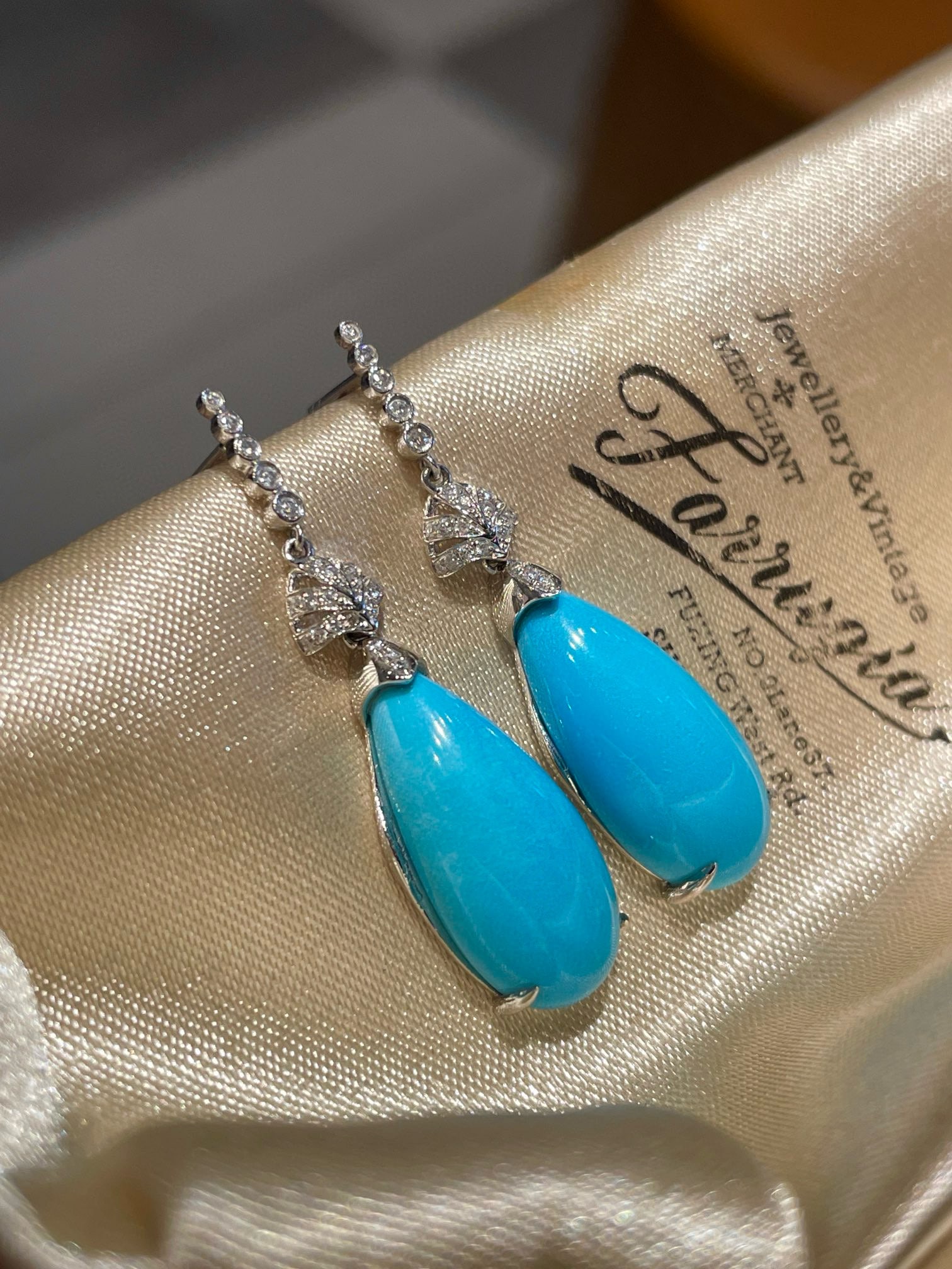 14k Gold 12.63 Ct Natural Blue Turquoise & Diamond Earrings: Ref:231082222 // gold content:14k gold // main gemstone:blue turquoise // shape:pear // carat weight:12. 63ct // color:blue // treatment:natural // // adjacent gemstone 2 : diamond // shape:round //