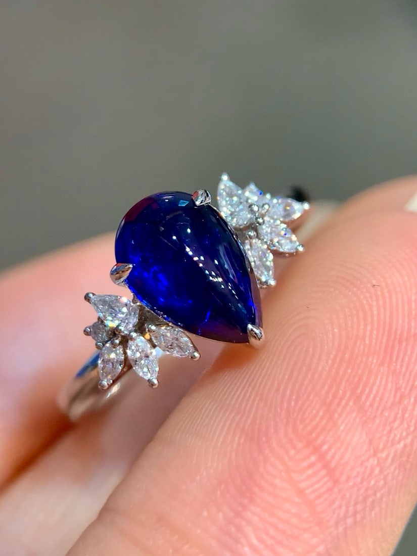 14k Gold 2.22 Ctw Vivid Blue Natural Sapphire & Diamond Ring: Ref:231082381 // gold content:14k gold // ring size:7. 25us // // main gemstone:sapphire // shape:pear // carat weight:1. 99ct // color:vivid blue // treatment:natural // // adjacent gemstone 2 :