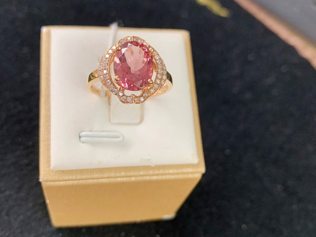 14k Gold 2.58 Ctw Natural Tourmaline & Diamond Ring: Ref:231082398 // gold content:14k gold // ring size:7. 25us // // main gemstone:tourmaline // shape:oval // carat weight:2. 41ct // color:pink // treatment:natural // // adjacent gemstone 2 : diamond