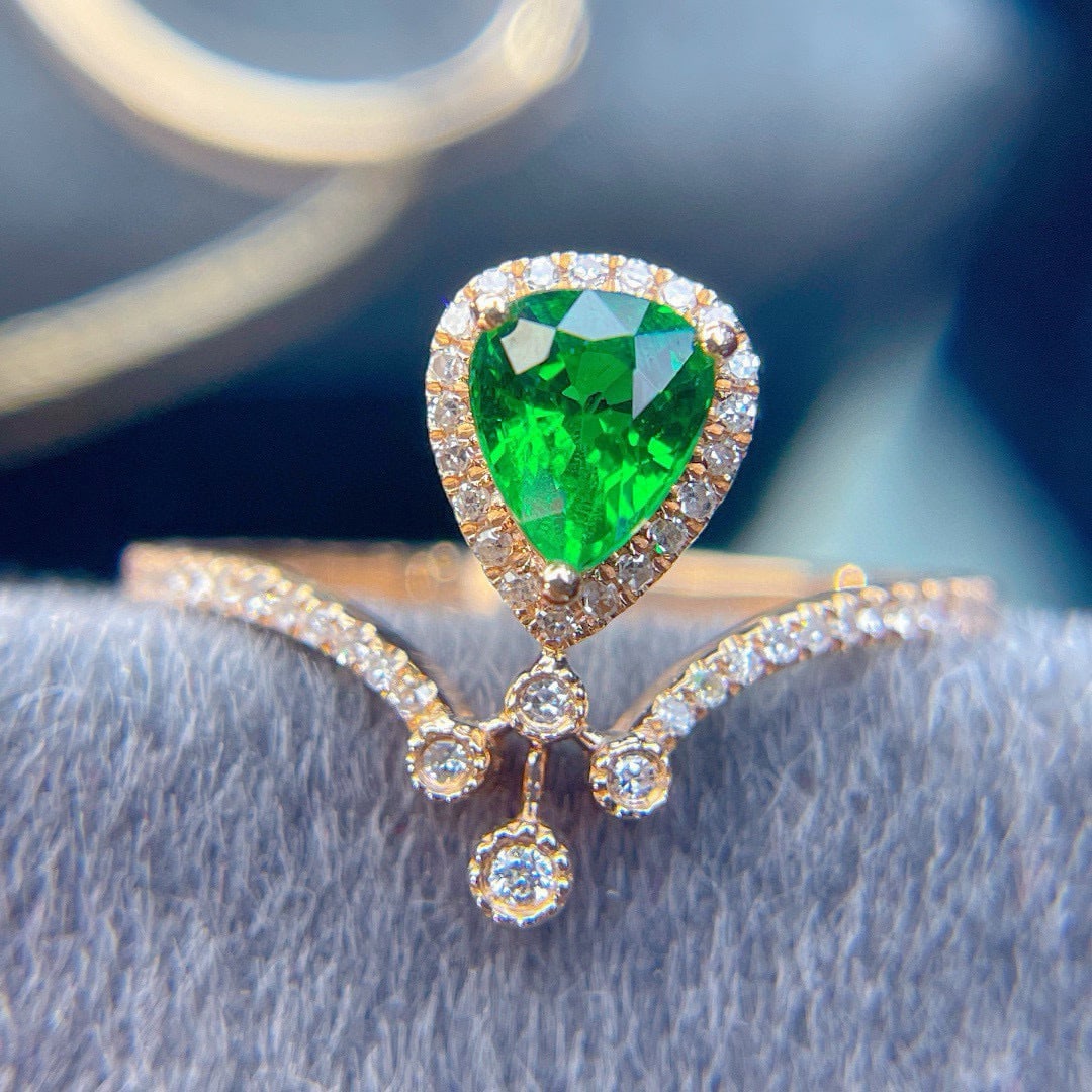 14k Gold 0.8 Ct Vivid Green Natural Tsavorite & Diamond Ring: Ref:231082434 // gold content:14k gold // ring size:7. 25us // // main gemstone:tsavorite // shape:pear // carat weight:0. 8ct // color:vivid green // treatment:natural // // adjacent gemstone 2 :