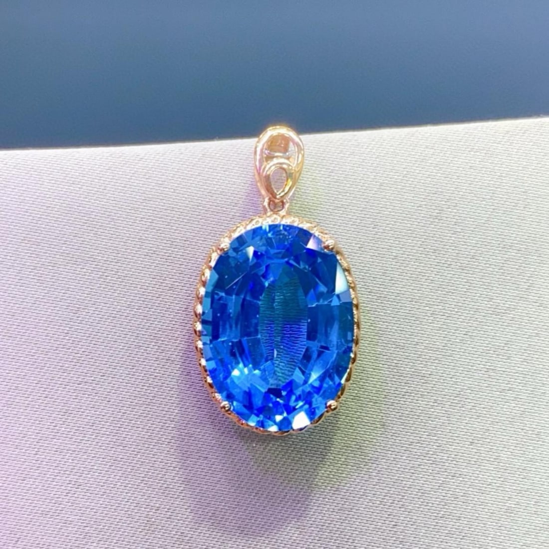 14k Gold 14.8 Ct Natural Topaz Pendant( Without Chain ): Ref:231159101 // gold content:14k gold // main gemstone:topaz // shape:oval // carat weight:14. 8ct // color:blue // treatment:natural // Condition: New Low Estimate: 2200.00 High Estimate: 3300.00
