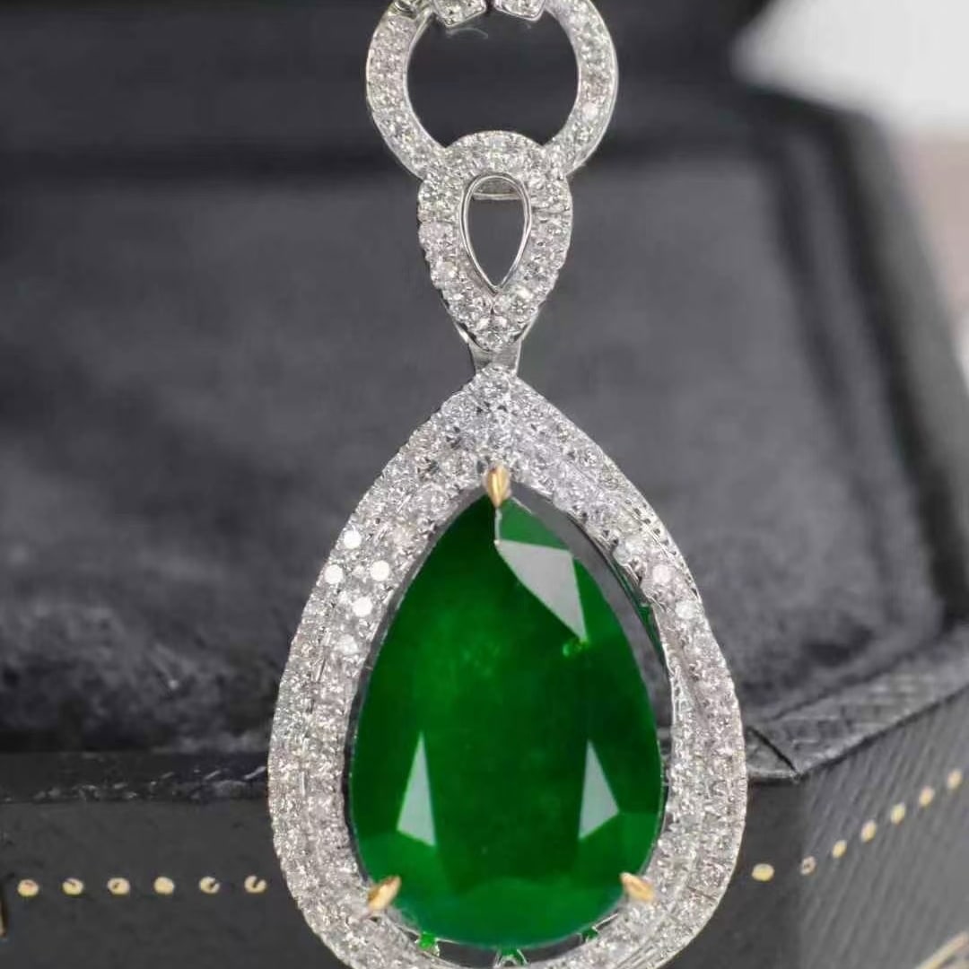 14k Gold 4.76 Ctw Natural Emerald & Diamond Pendant( Without Chain ): Ref:230947068 // gold content:14k gold // main gemstone:spessartine // shape:pear // carat weight:1. 27ct // color:orange // treatment:natural // // adjacent gemstone 2 : diamond // shape:round // cla