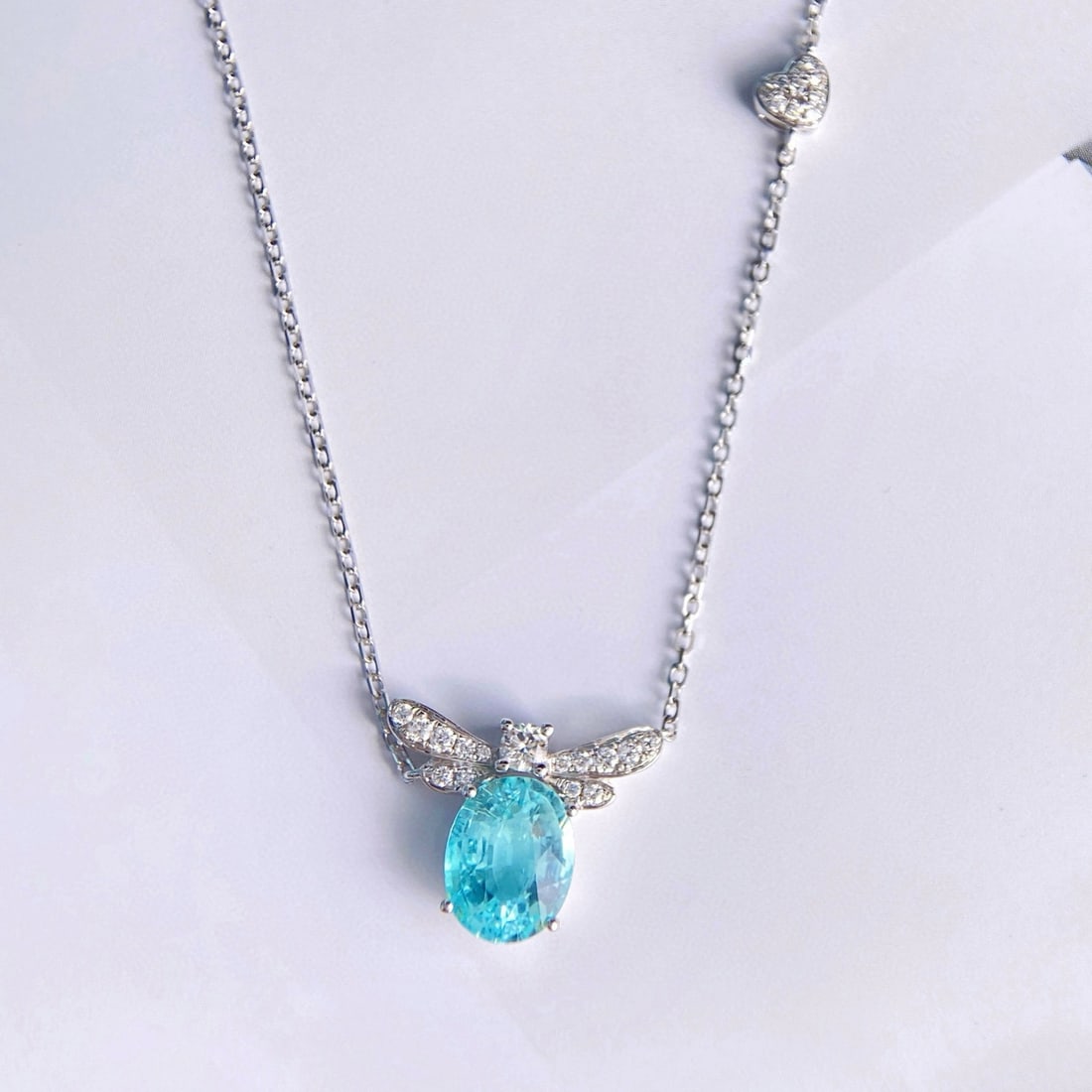14k Gold 2.60 Ctw Natural Paraiba Tourmaline & Diamond Necklace: Ref:231078065 // gold content:14k gold // main gemstone:paraiba tourmaline // shape:oval // carat weight:2. 30ct // color:blue // treatment:natural // // adjacent gemstone 2 : diamond // shape:round