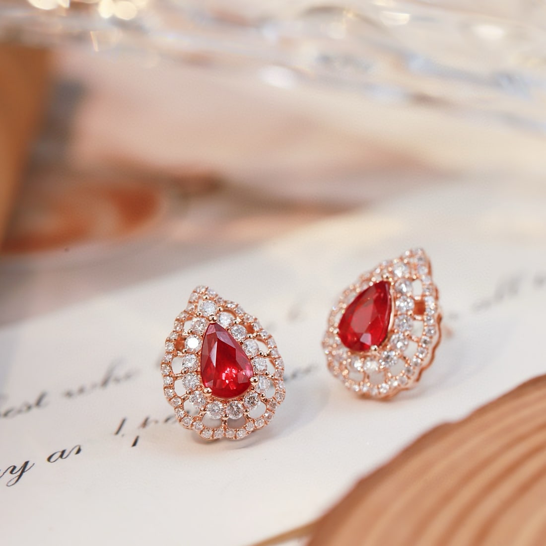 14k Gold 1.82 Ctw Natural Ruby & Diamond Earrings: Ref:231078247 // gold content:14k gold // main gemstone:ruby // shape:pear // carat weight:1. 21ct // color:red // treatment:natural // // adjacent gemstone 2 : diamond // shape:round // carat
