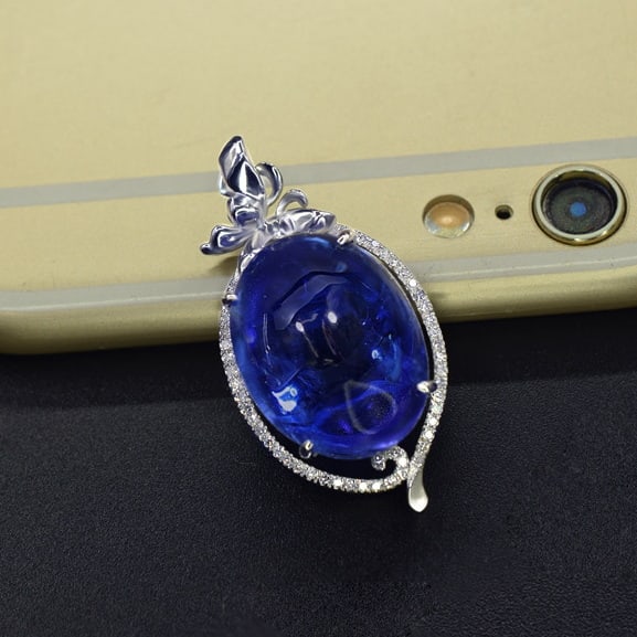 14k Gold 16.39 Ct Natural Tanzanite & Diamond Pendant( Without Chain ): Ref:231079013 // gold content:14k gold // main gemstone:tanzanite // shape:oval // carat weight:16. 39ct // color:blue // treatment:natural // // adjacent gemstone 2 : diamond // number of stones:47