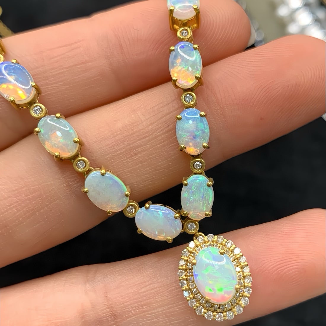 14k Gold 5.78 Ctw Natural Opal & Diamond Necklace: Ref:231079017 // gold content:14k gold // main gemstone:opal // shape:oval // carat weight:5. 35ct // color:color // treatment:natural // // adjacent gemstone 2 : diamond // number of stones:62 // sha