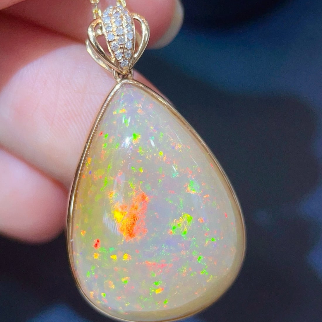 14k Gold 12.12 Ctw Natural Opal & Diamond Pendant( Without Chain ): Ref:231079043 // gold content:14k gold // main gemstone:opal // shape:pear // carat weight:12. 06ct // color:color // treatment:natural // // adjacent gemstone 2 : diamond // shape:round // carat