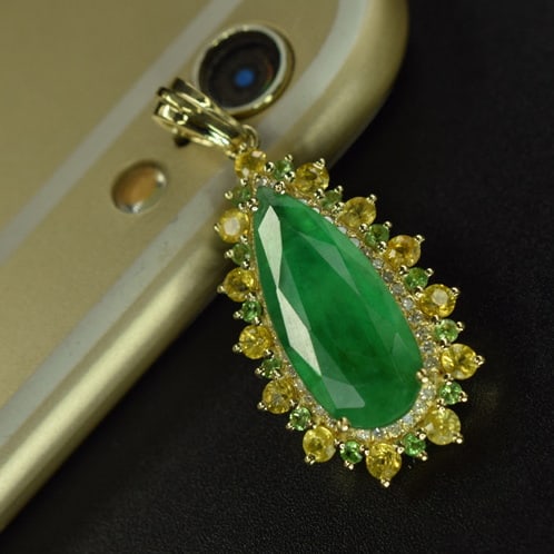 14k Gold 3.48 Ctw Natural Emerald & Diamond & Sapphire Pendant( Without Chain ): Ref:231079064 // gold content:14k gold // main gemstone:emerald // shape:pear // carat weight:3. 05ct // color:green // treatment:natural // // adjacent gemstone 2 : diamond // number of stones:37 //