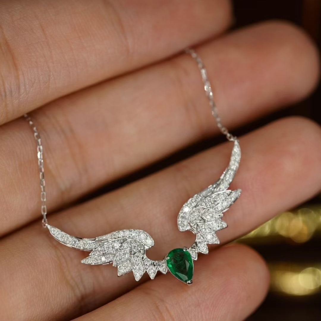 14k Gold 0.64 Ctw Natural Emerald & Diamond Necklace: Ref:231079077 // gold content:14k gold // main gemstone:emerald // shape:pear // carat weight:0. 34ct // color:green // treatment:natural // // adjacent gemstone 2 : diamond // shape:round // carat