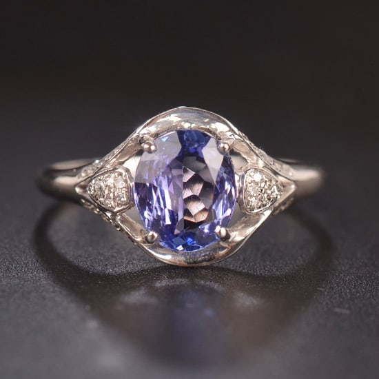 14k Gold 1.4 Ct Natural Tanzanite & Diamond Ring: Ref:231079122 // gold content:14k gold // ring size:7. 25 us // // main gemstone:tanzanite // shape:oval // carat weight:1. 4ct // color:blue // treatment:natural // // adjacent gemstone 2 : diamond /