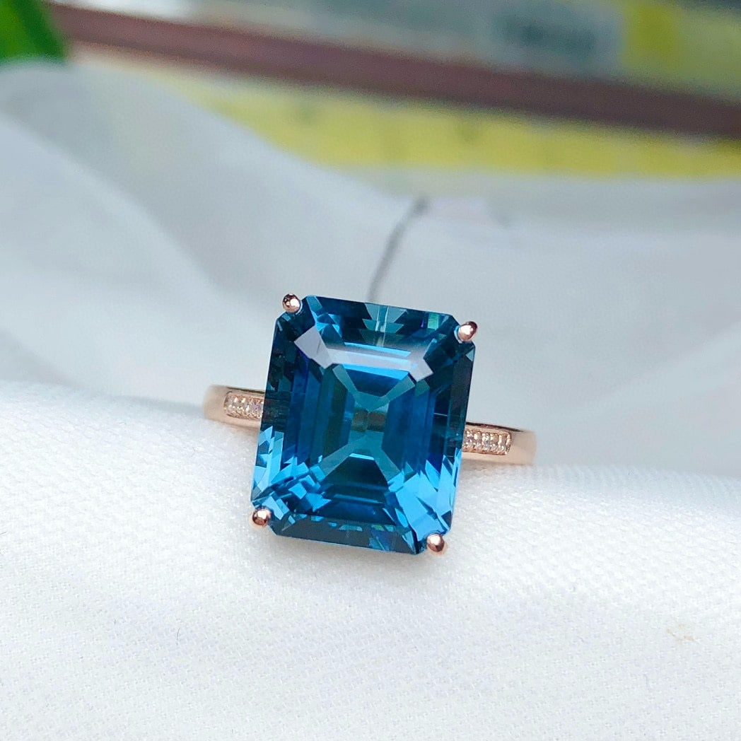 14k Gold 8.6 Ct Natural Topaz & Diamond Ring: Ref:231079158 // gold content:14k gold // ring size:7. 25 us // // main gemstone:topaz // shape:octagonal // carat weight:8. 6ct // color:blue // treatment:natural // // adjacent gemstone 2 : diamond
