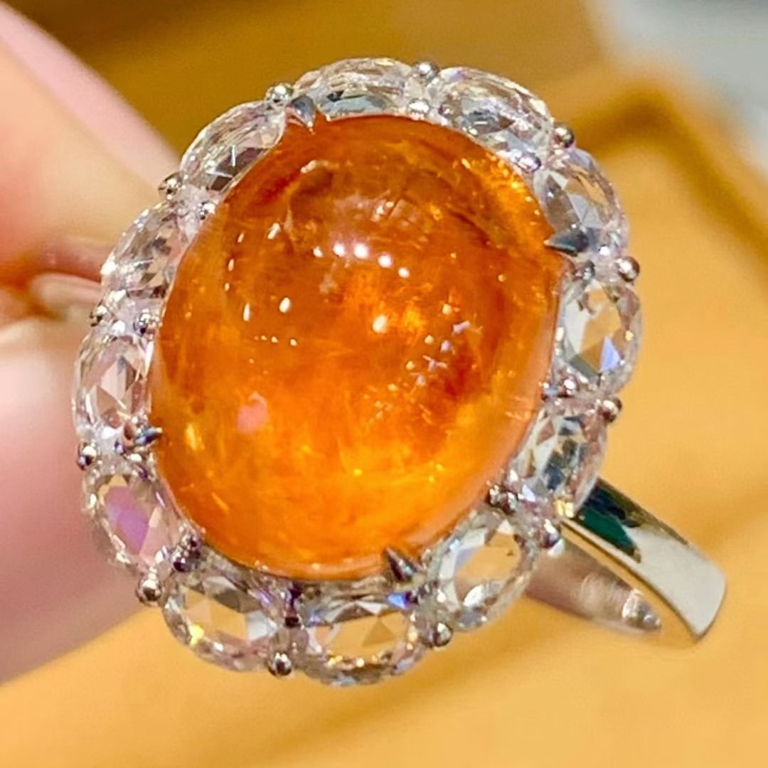 14k Gold 5.2 Ct Natural Spessartine & Sapphire Ring: Ref:231079207 // gold content:14k gold // ring size:7. 25 us // // main gemstone:spessartine // shape:oval // carat weight:5. 2ct // color:orange // treatment:natural // // adjacent gemstone 2 : sapph