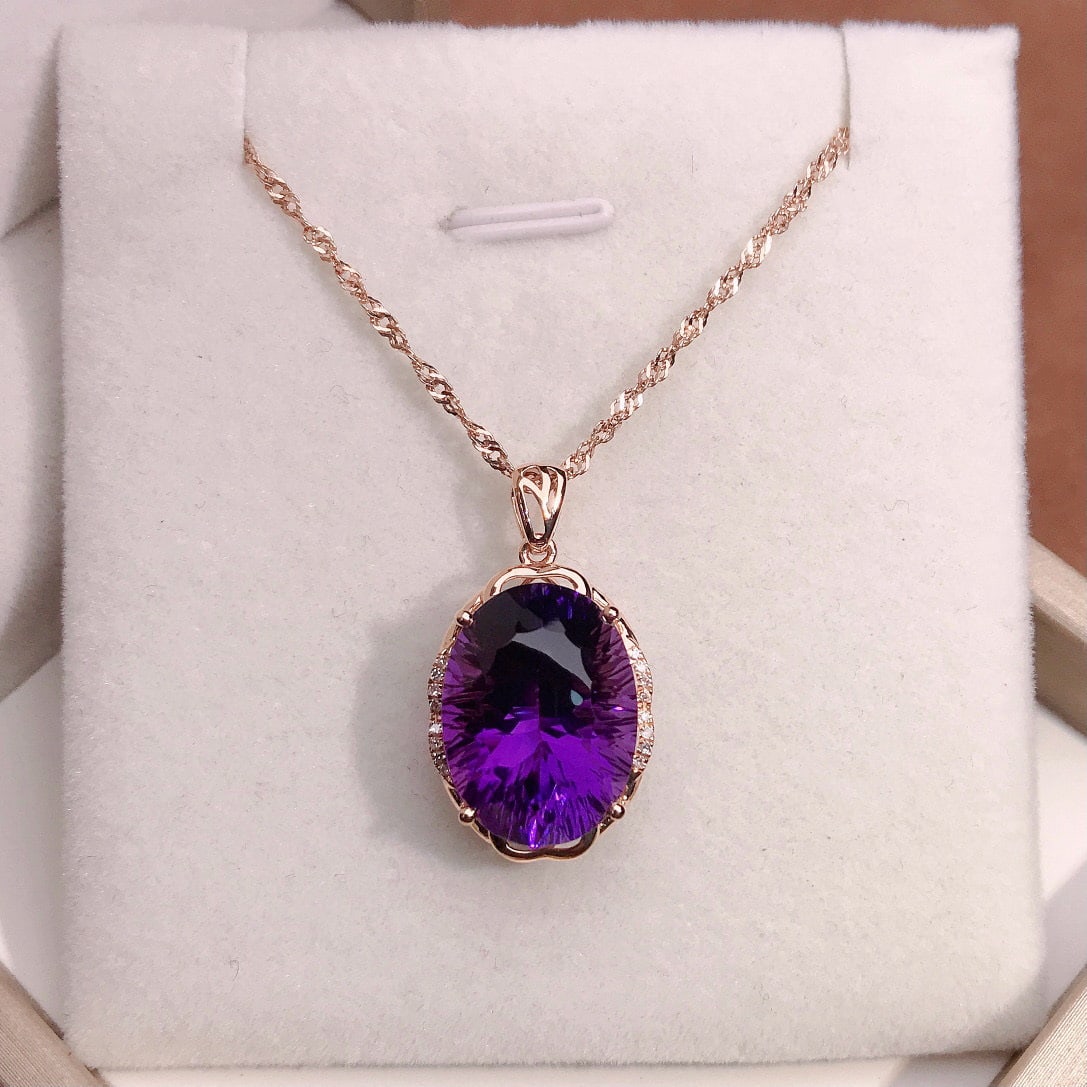 14k Gold 10.00 Ctw Natural Amethyst & Diamond Pendant( Without Chain ): Ref:231079213 // gold content:14k gold // main gemstone:amethyst // shape:oval // carat weight:9. 95ct // color:purple // treatment:natural // // adjacent gemstone 2 : diamond // number of stones:16 /