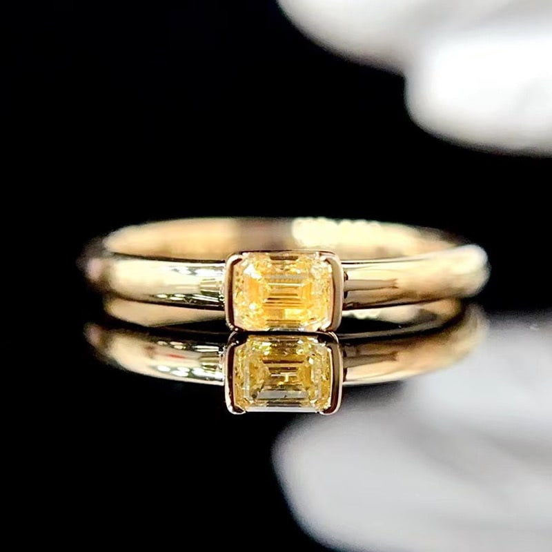 14k Gold 0.3 Ct Natural Yellow Diamond & Solitaire Ring: Ref:231079233 // gold content:14k gold // ring size:7. 25 us // // main gemstone:yellow diamond // shape:emerald // carat weight:0. 3ct // color:yellow // treatment:natural // Low Estimate: 2600 High