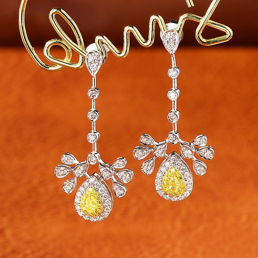 14k Gold 0.94 Ct Natural Color Diamond Earrings: Ref:231080034 // gold content:14k gold // main gemstone:diamond // shape:multiple // carat weight:0. 94ct // clarity grade:vs-si // color:color // treatment:natural // Condition: New Low Estimate: 620